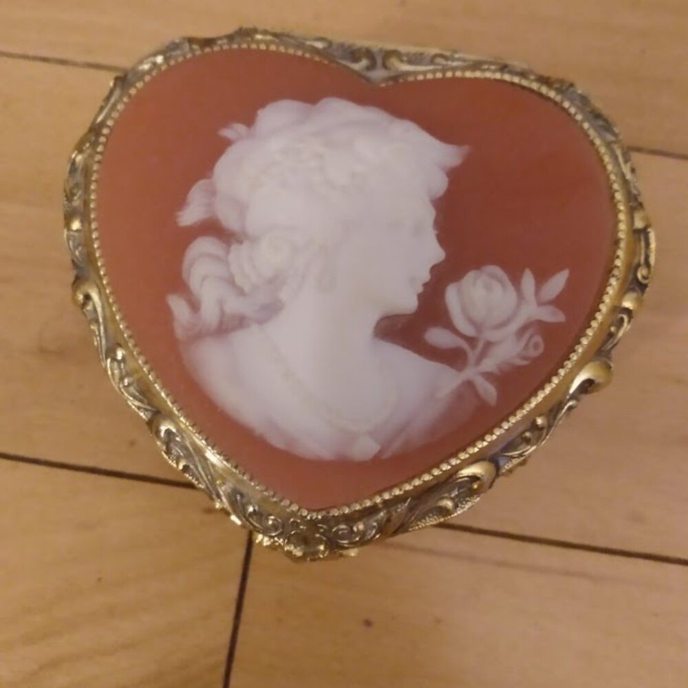 Vintage cameo music/jewelry/trinket box footed with floral design.